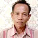 Iskandar (51), pelaku pembuhuhan tetangganya sendiri yang divonis Hakim 13 tahun penjara.