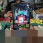 Bulog Dorong Pedagang Pasar Gunakan QRIS, Pastikan Harga Minyakita Sesuai HET